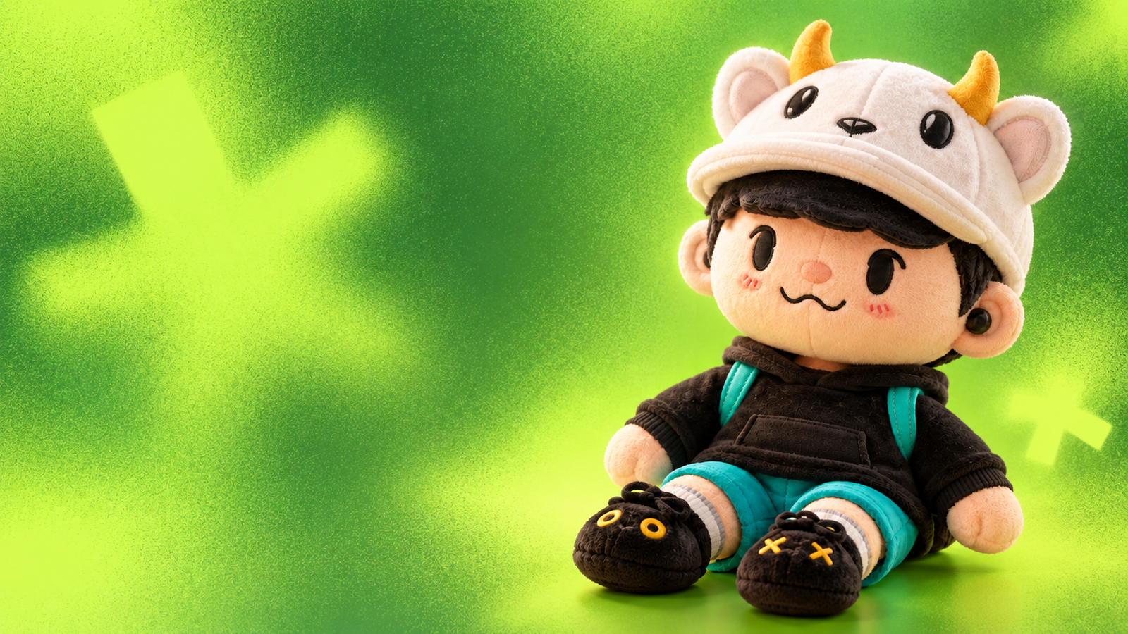 Owlanni de peluche sobre fondo verde